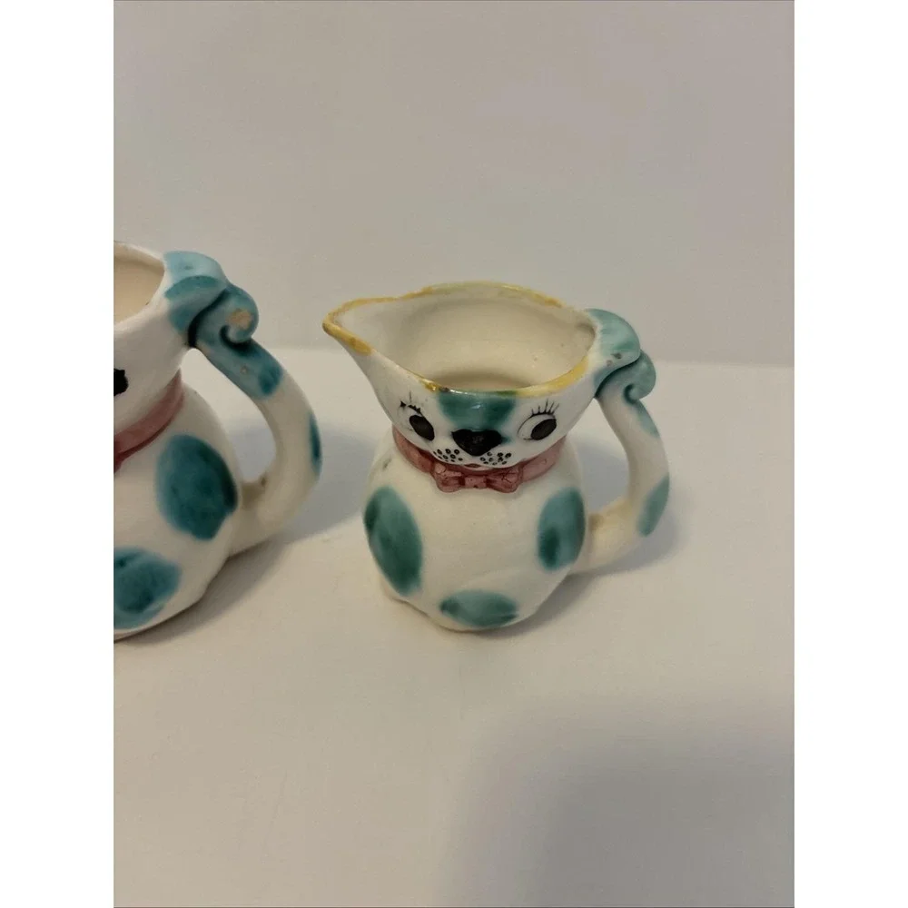 Vintage 1950s ceramic cat pitchers, creamers or part of measuring cup sets.